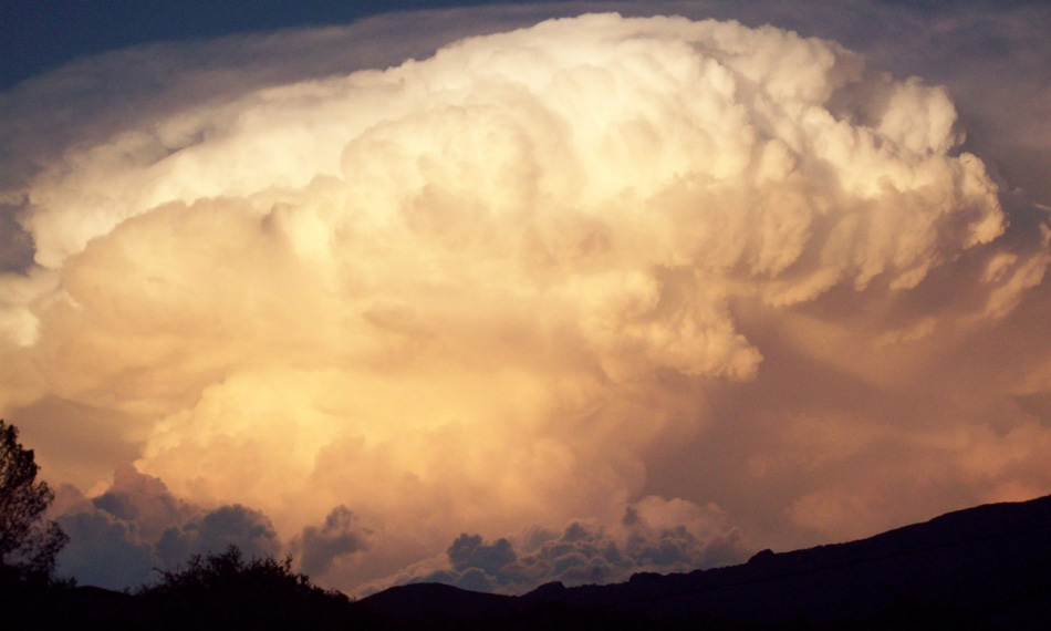 Clouds of a massive thunderstorm billow in the sky