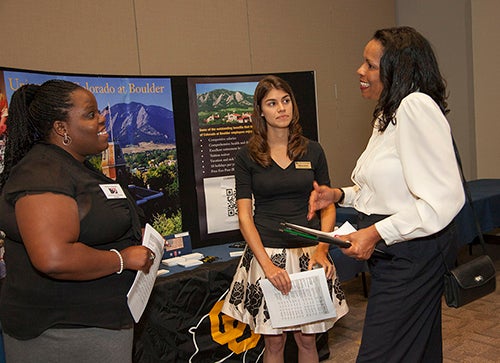 UCAR veterans job fair: 3 women conversing