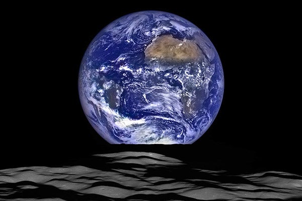 Earth rises above the limb of the moon