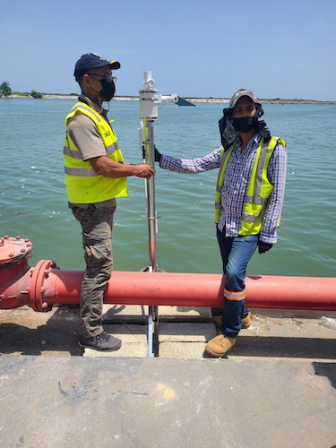ONAMET staff install a 3D-PAWS storm surge sensor in the Dominican Republic