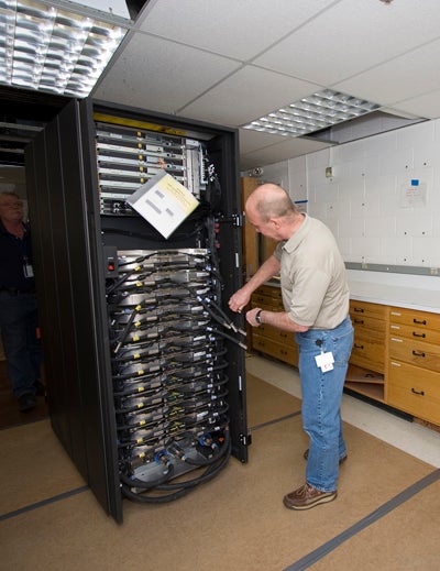 Large computer equipment with a man working on it