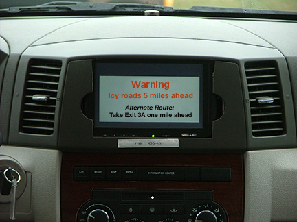 Photograph of a dashboard with a warning screen built into it