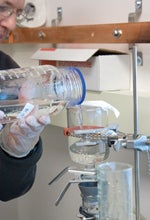 Researcher extracts carbon from snow samples.