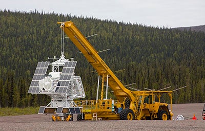 Truck with crane carrying scientific eauipment