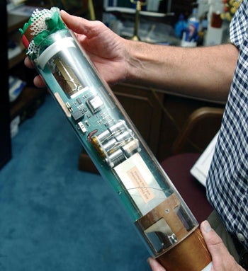 Photo of hands holding a dropsonde