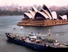 Photo of Syndey Opera House with a ship in the bay