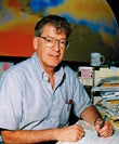 Photo of a man sitting at a desk