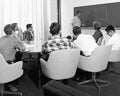 Photo of people sitting in a meeting