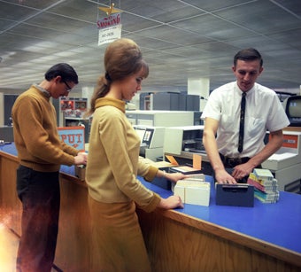 People in an old computer room
