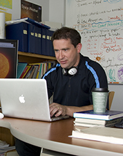 portrait of Scott McIntosh at his computer