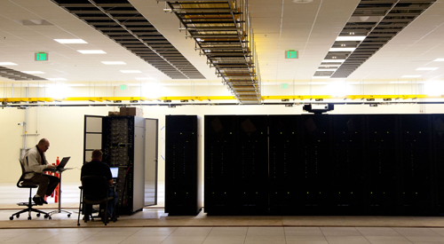 A view of a computer operator at left with some of the Yellowstone cabinets