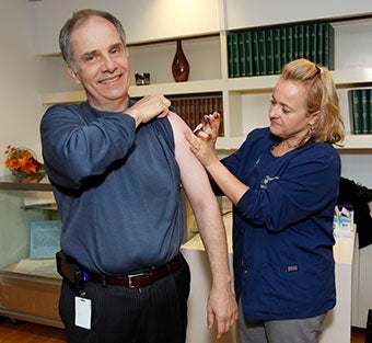 Tom Bogdan receiving flu shot.