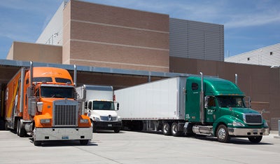 3 tractor trailers lined up at the NWSC dock