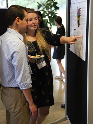 ASP 2014 summer colloquium dinner: two participants during poster session