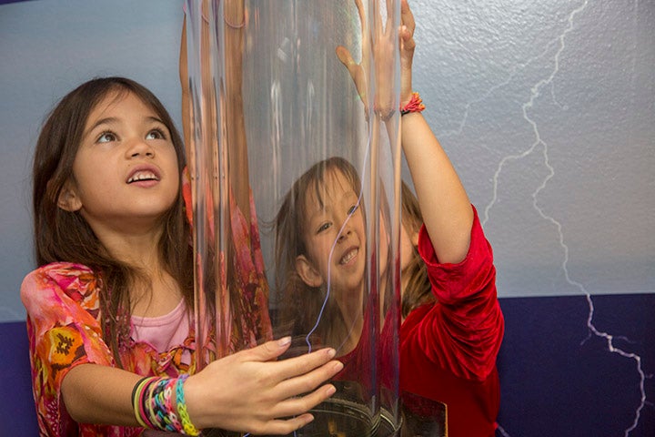 Children with lightning exhibit at Super Science Saturday, October 2009