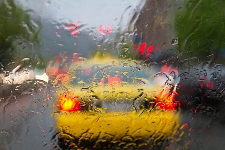 Imagery of raindrops on car windshield
