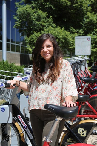 Chelsea Gitlin-Castellano with B-Cycle bikes at UCAR