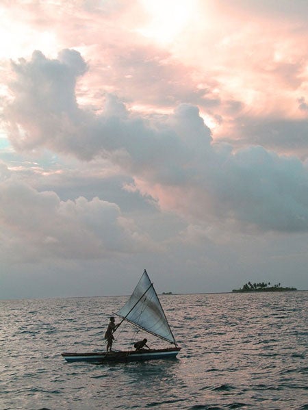 Sailboat plies Pacific waters near Kiribati in the Pacific Ocean