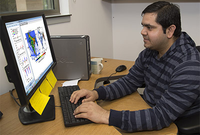 NCAR researcher Rajesh Kumar on his computer studying black carbon emissions in India.