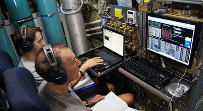 Alan Hills and Jason Schroeder aboard NSF/NCAR C-130 research aircraft