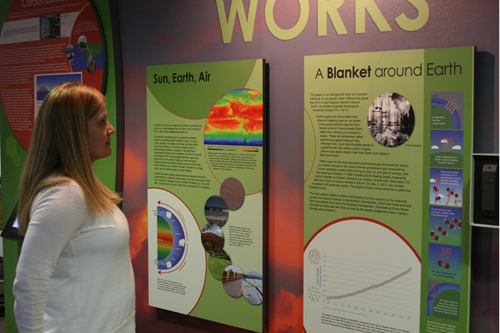 New NCAR climate exhibit: exhibits manager Becca Hatheway examines display