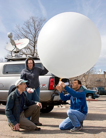 Researchers work on MGAUS, which will be used to launch weather balloons during VORTEX2