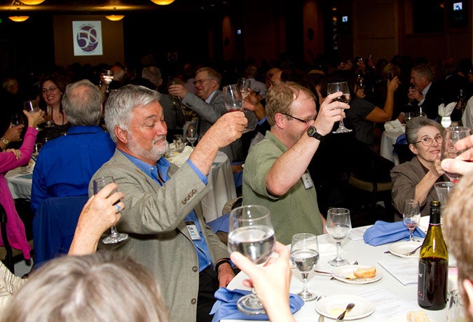 People making a toast at the banquet.