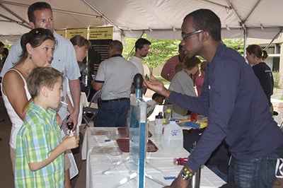 Researcher explaining science to the public.