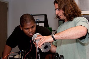 Curtis Walker and Scott Sewell working with instrumentation.