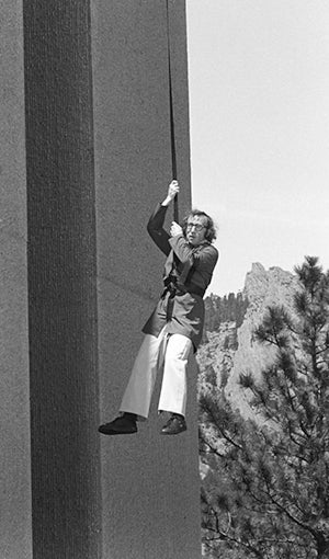 Woody Allen dangling from rope from Mesa Lab.