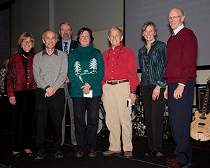 Award winners on stage receiving award