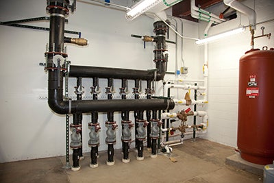 Pipes going into building.