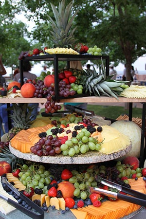 Trays of fruit and cheese.