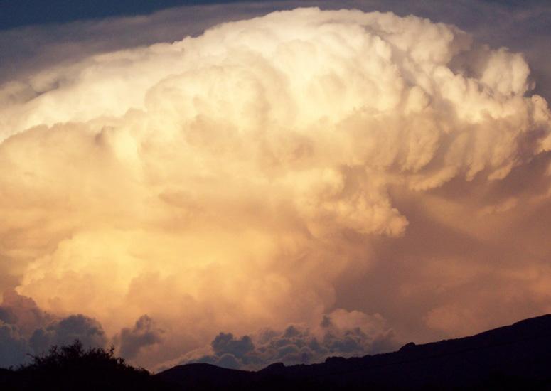Clouds of a massive thunderstorm billow in the sky