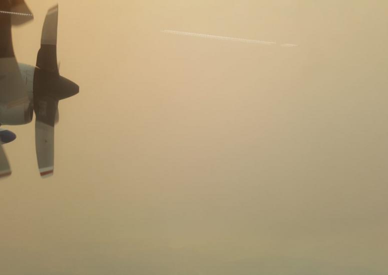 Research aircraft flies through smoke.