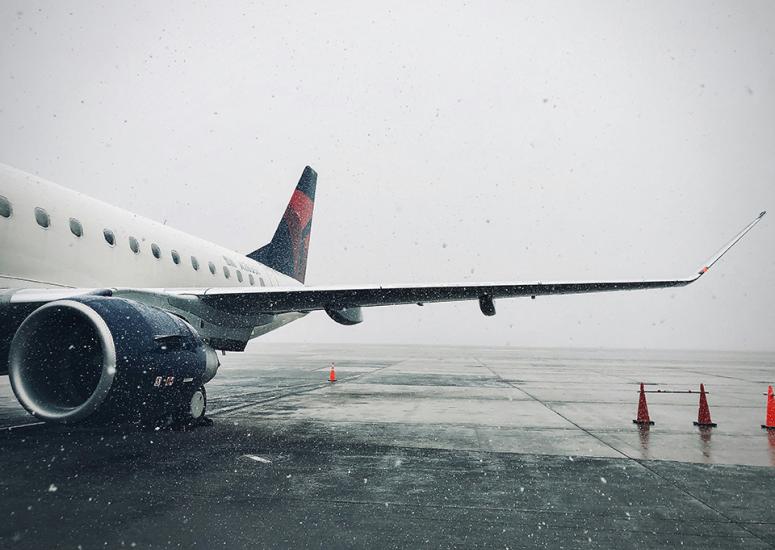 Shot of an airplane wing in the snow. 