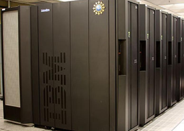 Photograph of a large, super computer, black with IBM on side