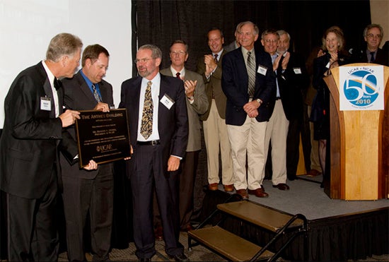 UCAR Board of Trustees presents the Anthes Building plaque to Rick Anthes