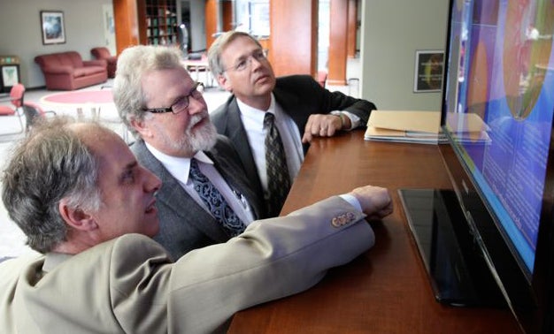Tom Bogdan and visitors view MLSO imagery on terminal