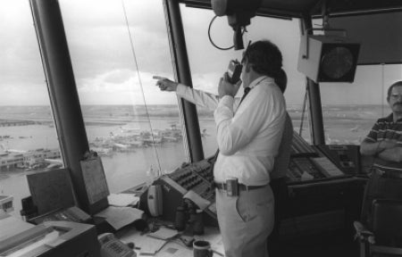 John McCarthy in control tower at Stapleton Airport, Denver, during CLAWS project, 1984