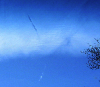 Contrail crossing mystery cloud