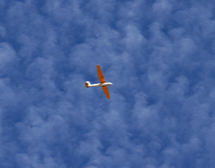 Glider against mystery cloud