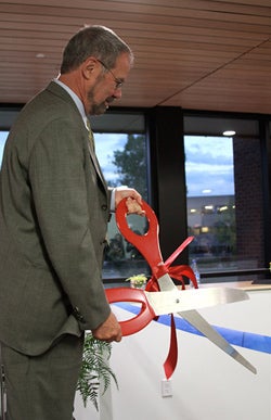 Rick Anthes cuts the FLA ribbon.